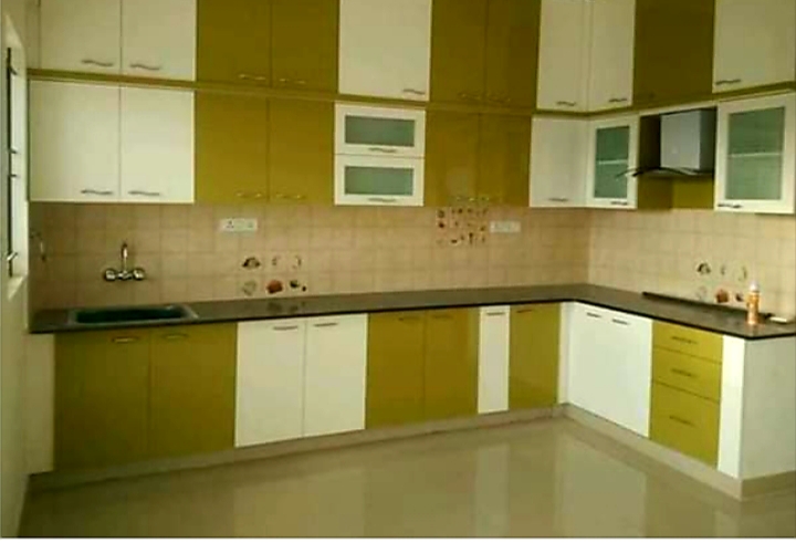 High-gloss olive green and cream U-shaped kitchen Bharatpur